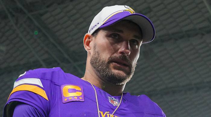 Vikings quarterback Kirk Cousins leaves the field after a win.